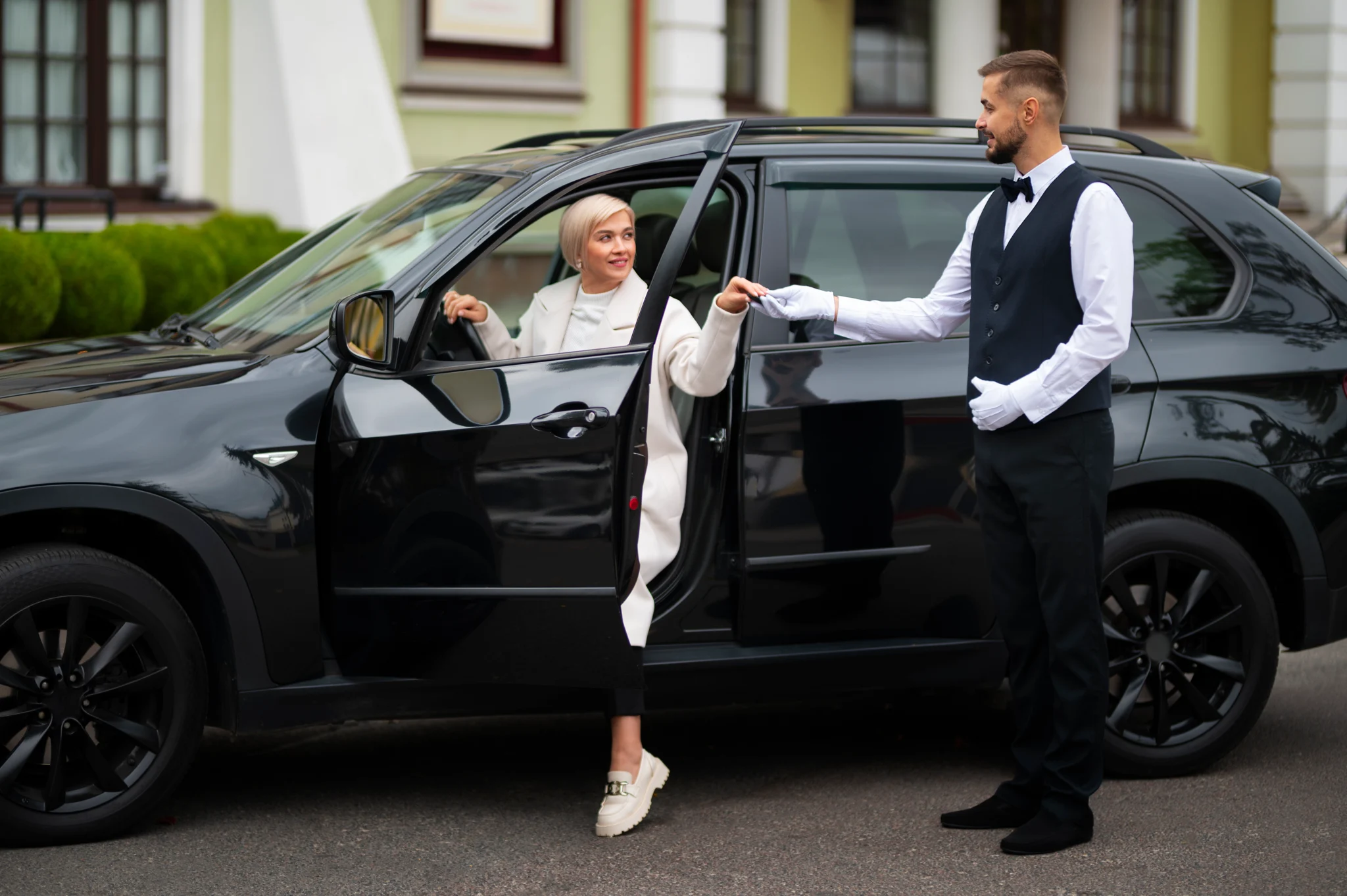 Black luxury car with chauffeur for formal hire in Gold Coast