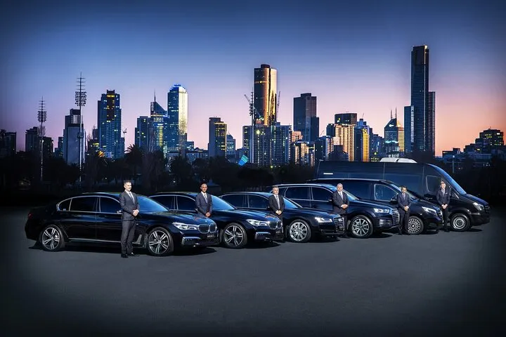 Chauffeur service Melbourne Airport pickup with professional driver assisting passenger at terminal