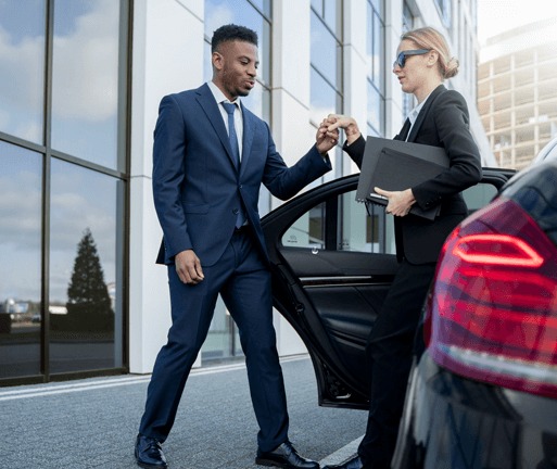 Chauffeur assisting executive arrival with discretion in Brisbane CBD