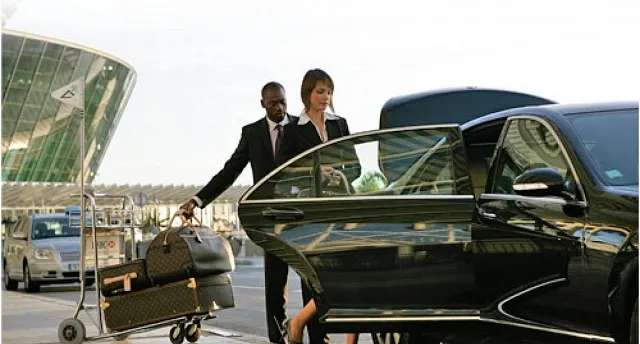 Airport pickup services with private chauffeur waiting at arrivals in Australia