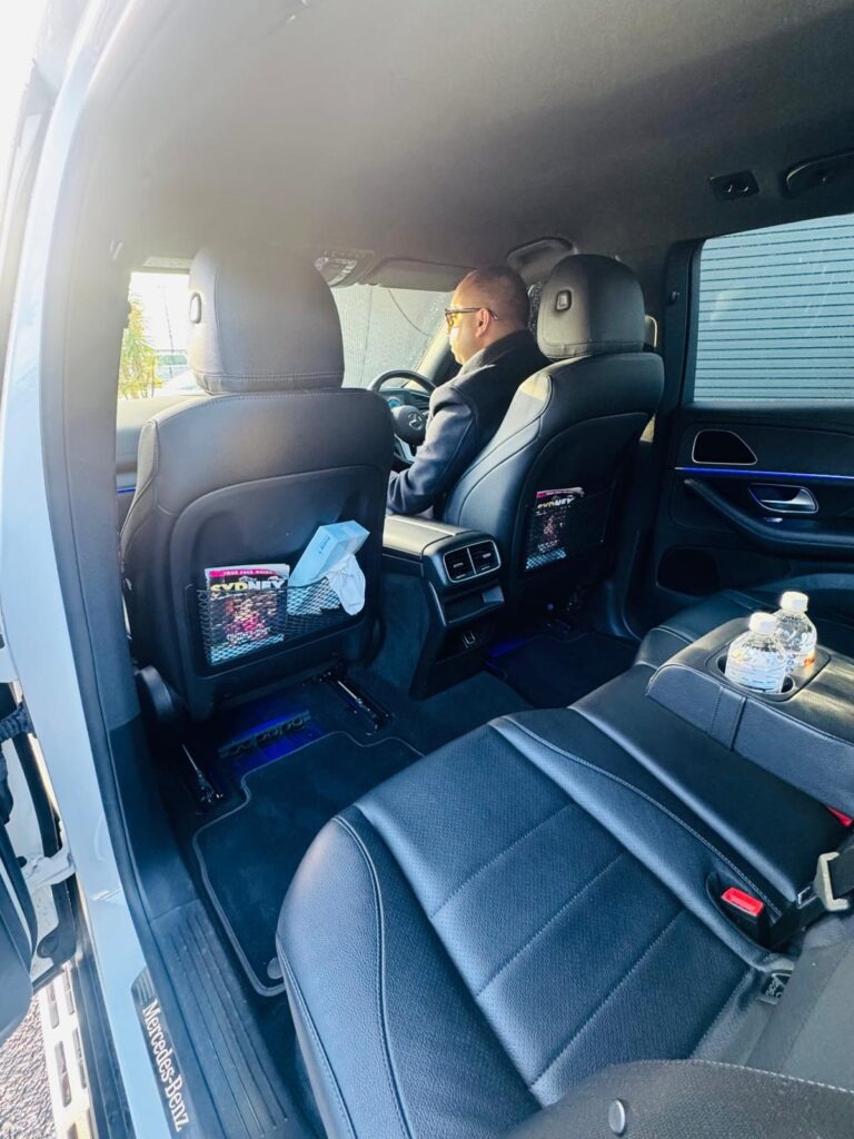 Client relaxing inside luxury chauffeur vehicle during Sydney transfer