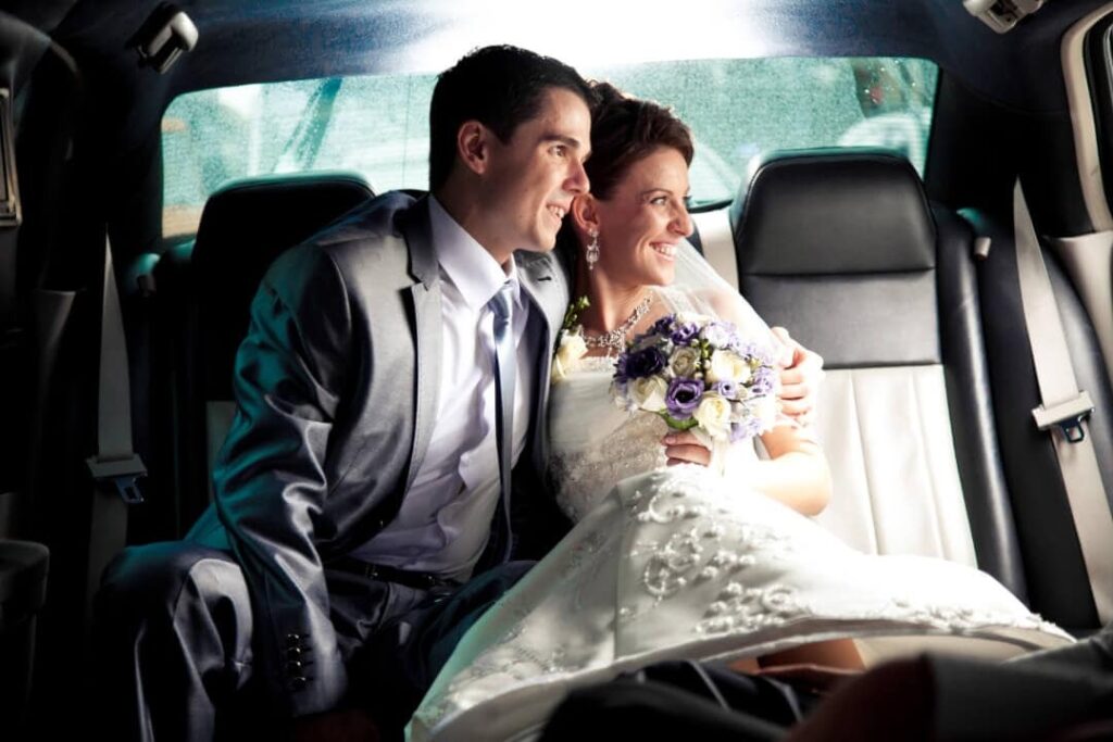 Professional chauffeur assisting bride during bridal car hire in Melbourne